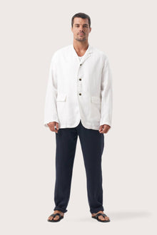 Model wearing the natural white linen Masa jacket by By The Sea Bali