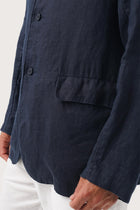 Close-up texture of the breathable linen fabric and premium craftsmanship