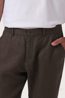 Close-up detail of the Maury Linen Long Pant in Chocolate highlighting the shell-button closure by By The Sea Bali