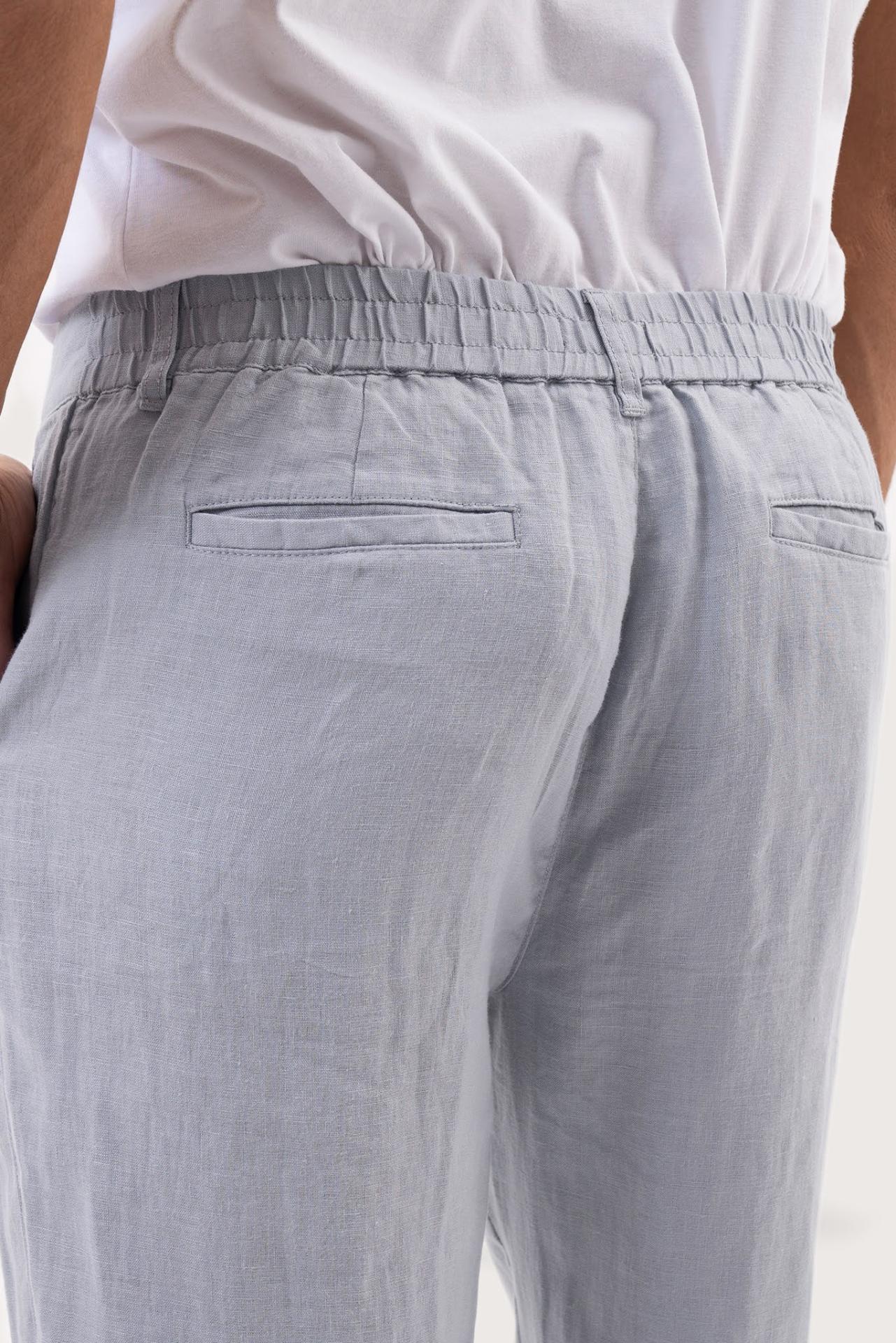 Back pocket detail of the Light Blue Maury Linen Long Pant revealing its refined linen tailoring by By The Sea Bali