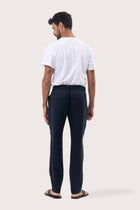 Back view of the Navy Maury Linen Long Pant showcasing its slit pockets and belt loops by By The Sea Bali