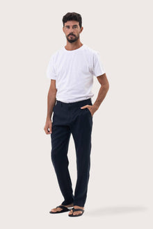 Angled front view of the Maury Linen Long Pant in Navy by By The Sea Bali in breathable 100% linen