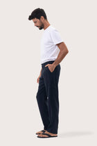 Side profile of the Maury Linen Long Pant in Navy by By The Sea Bali, tailored in pure linen