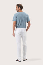Back view of the White Maury Linen Long Pant showcasing its slit pockets and belt loops by By The Sea Bali