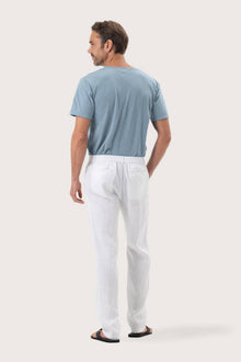 Back view of the White Maury Linen Long Pant showcasing its slit pockets and belt loops by By The Sea Bali