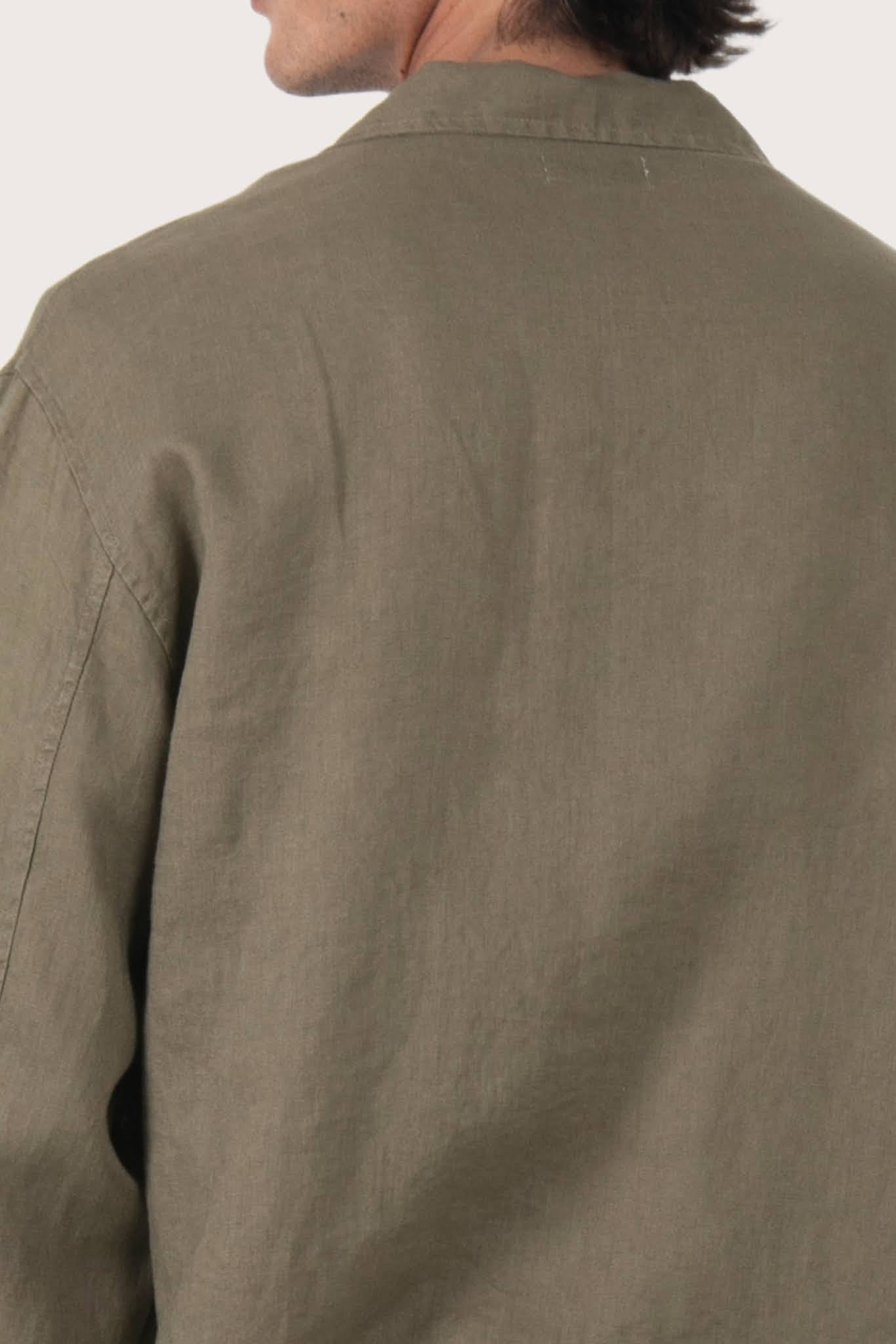 Detailed back view highlighting the linen construction and relaxed silhouette
