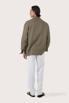 Back view of the brown linen jacket with a relaxed and contemporary silhouette