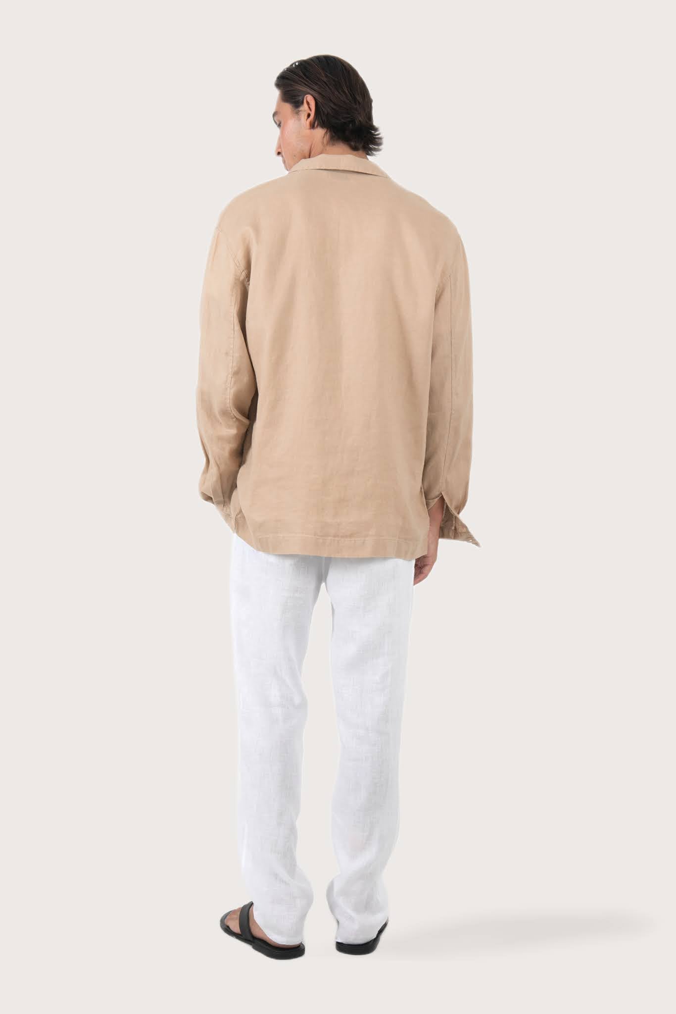 Back view of the creme linen jacket with a relaxed and contemporary silhouette