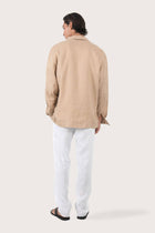 Back view of the creme linen jacket with a relaxed and contemporary silhouette