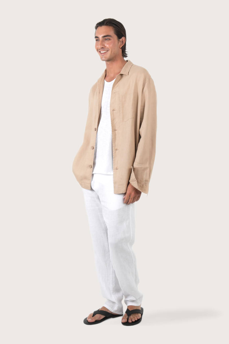 Side profile of the creme linen jacket showcasing its comfortable fit and effortless drape