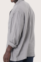 Detailed back view highlighting the linen construction and relaxed silhouette