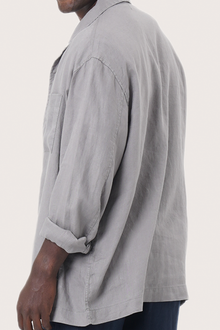 Detailed back view highlighting the linen construction and relaxed silhouette