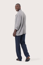 Back view of the grey linen jacket with a relaxed and contemporary silhouette
