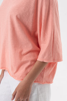 Close up detail of the Mawa Cotton T-Shirt Pink highlighting craftsmanship and design features.