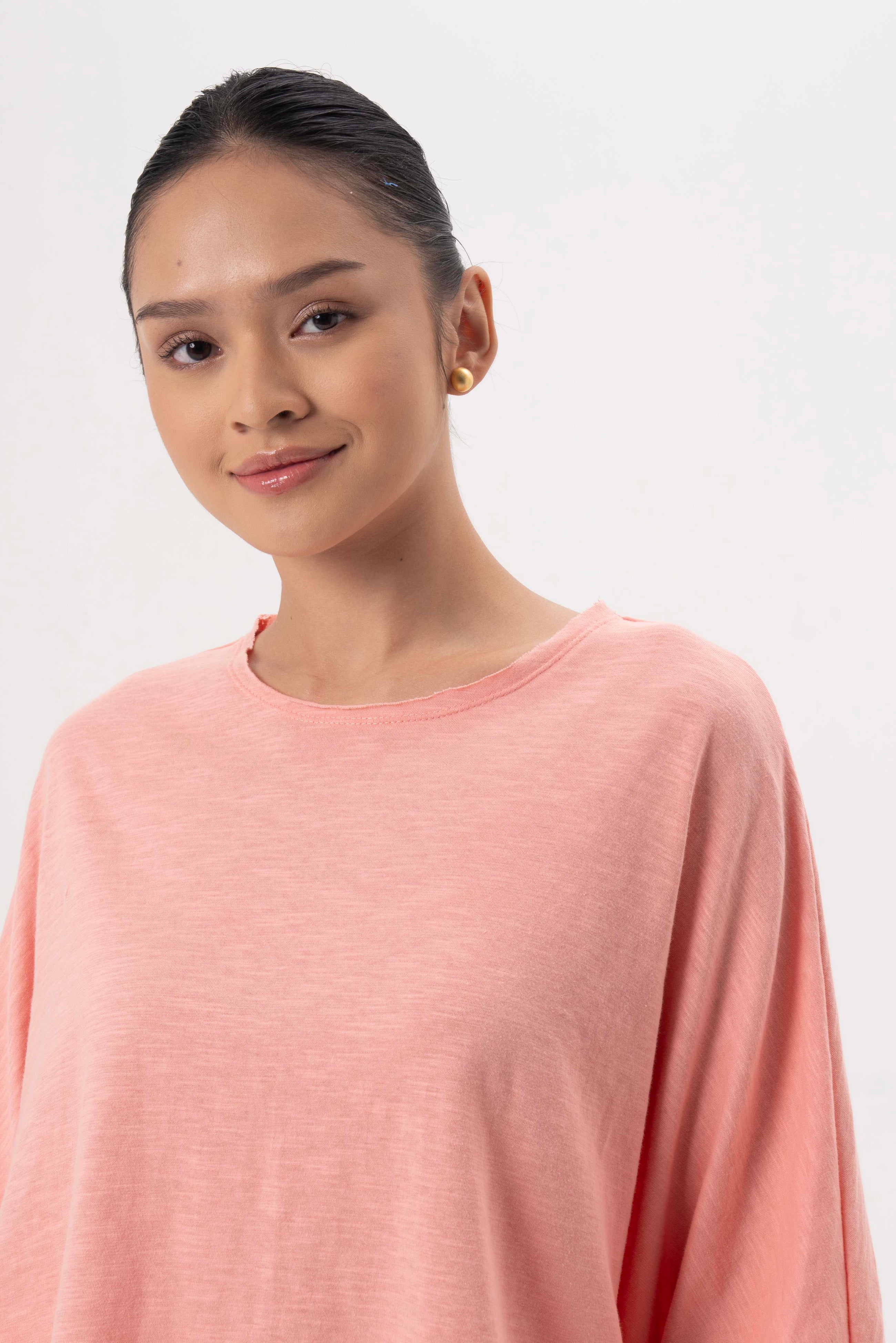 Close up detail of the Mawa Cotton T-Shirt Pink highlighting craftsmanship and design features.