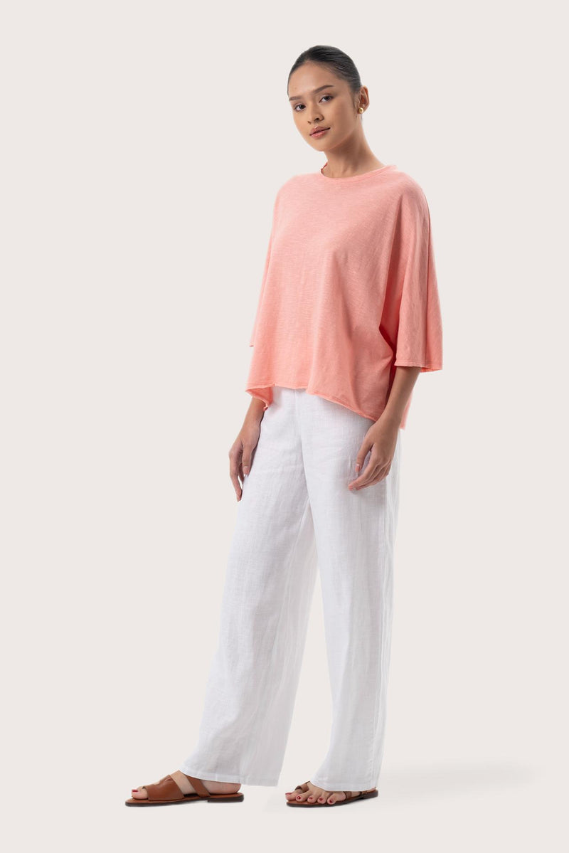 Side profile of the Mawa Cotton T-Shirt Pink showing its cut and natural movement.
