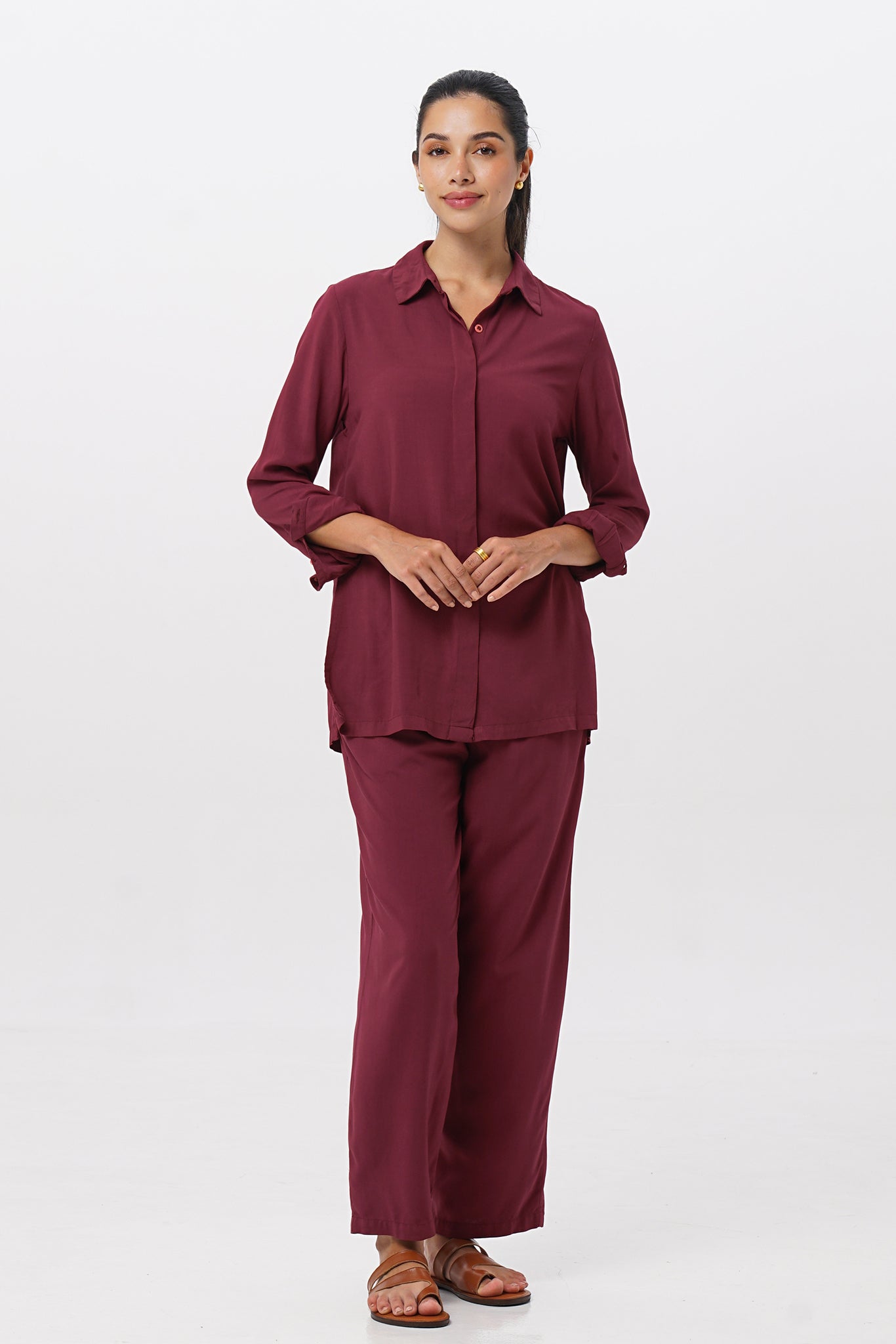 Woman wearing the Maya Drawstring Pants Brick combined with matching color shirt