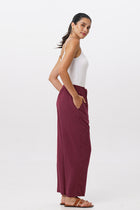 Side profile of the Maya Drawstring Pants Brick showing its cut and natural movement.