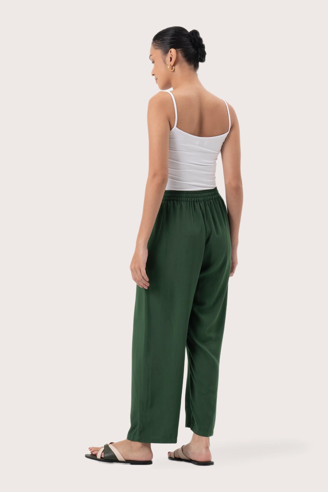 Back view of the Maya Drawstring Pants Forest Green highlighting the garment shape and drape.