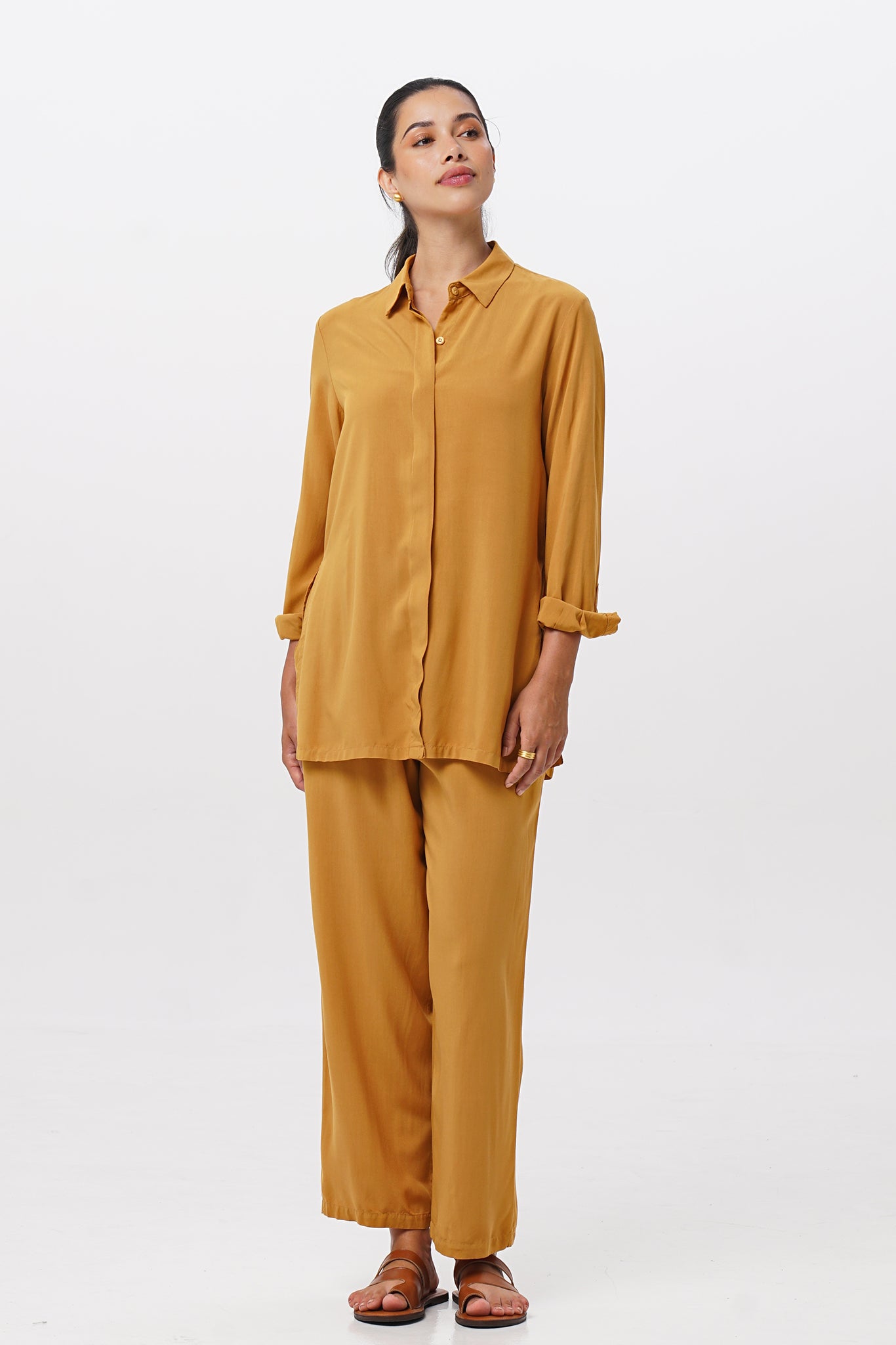 Woman wearing the Maya Drawstring Pants Mustrad combined with matching color shirt