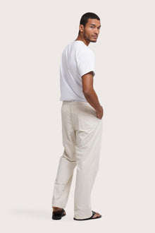 Back view of the Creme Cotton Relax Drawstring Pant showcasing its welt pocket detail by By The Sea Bali