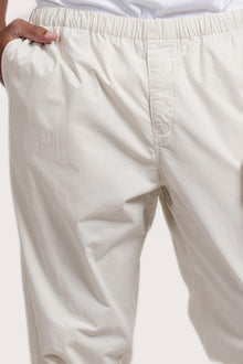 Close-up detail of the Cotton Relax Pant in Creme featuring the dove-button drawstring waist by By The Sea Bali