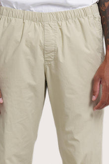 Close-up detail of the Light Grey Green Cotton Relax Pant featuring the dove-button drawstring waist by By The Sea Bali
