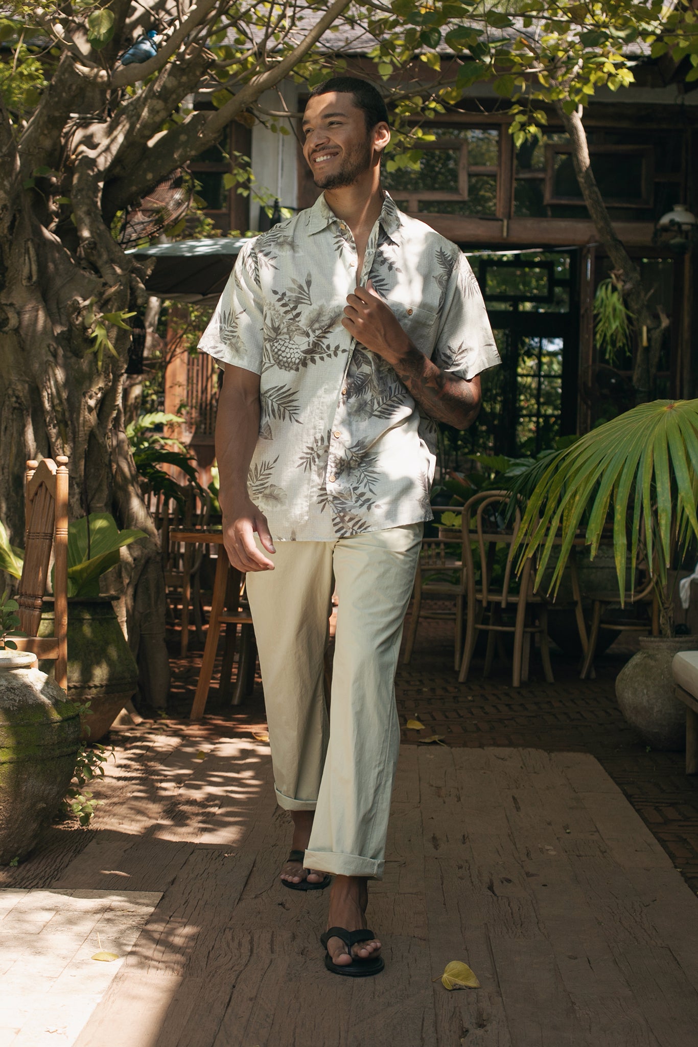 Lifestyle look featuring the Cotton Relax Drawstring Pant in Light Grey Green by By The Sea Bali — elevated men's resortwear