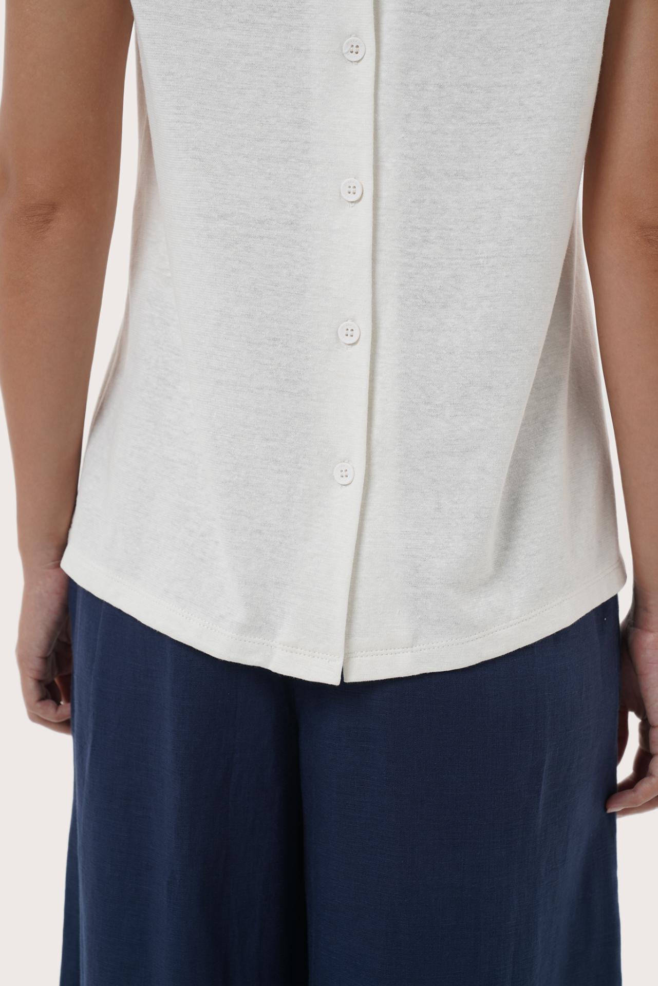 By The Sea Bali Lightweight fabric and tailored detail highlighting the Mera Sleeveless Top's breathable feel