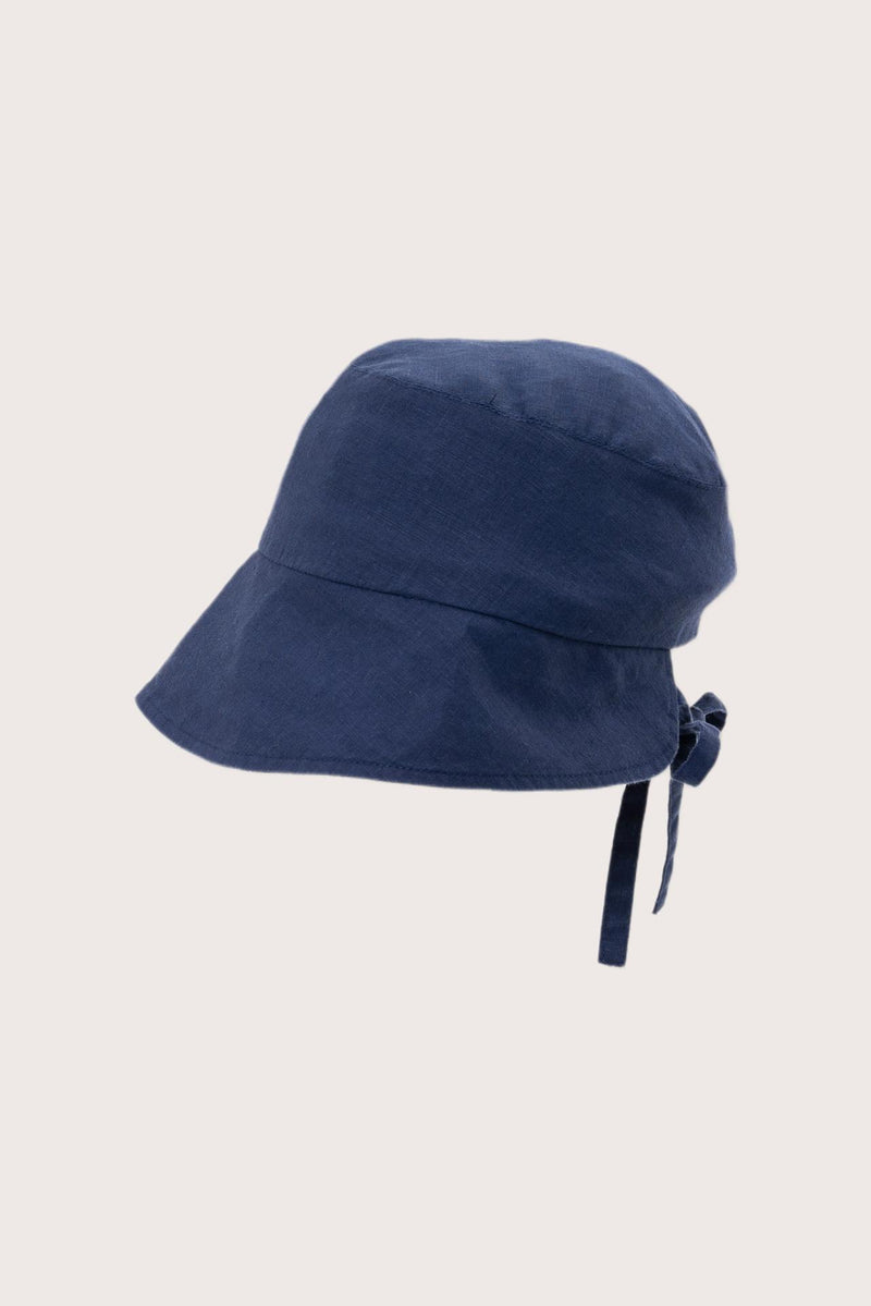 Side view of the Miki Linen Half Brim Hat Navy highlighting its soft linen construction and distinctive half-brim design