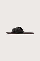 Side profile of Milos sandal in marrone highlighting sleek and modern resort footwear silhouette