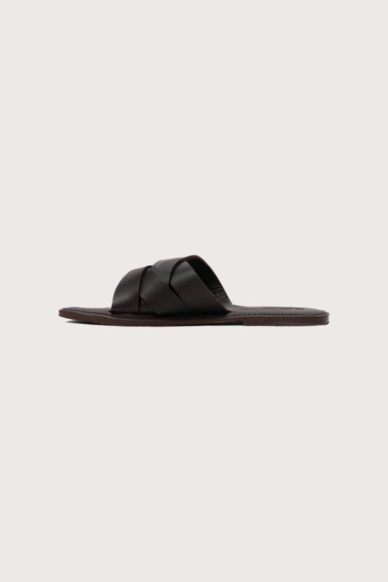 Side profile of Milos sandal in marrone highlighting sleek and modern resort footwear silhouette