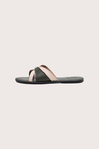 Side profile of Mina sandal in forest green highlighting sleek and modern resort footwear silhouette