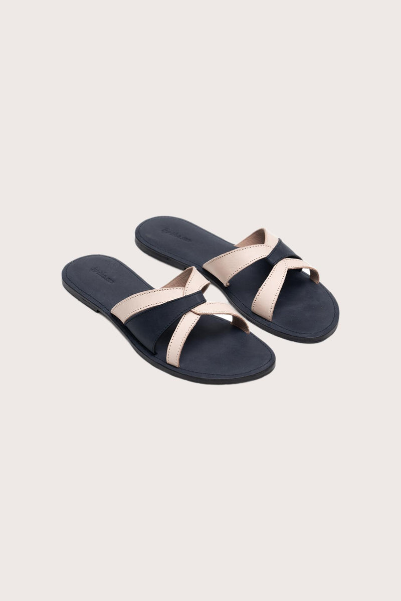 Mina sandal in navy front view showcasing elegant straps and minimalist resort aesthetic