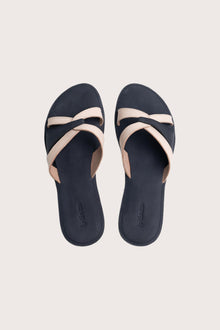 Mina sandal in navy shown in a global view highlighting its full silhouette and refined resort design