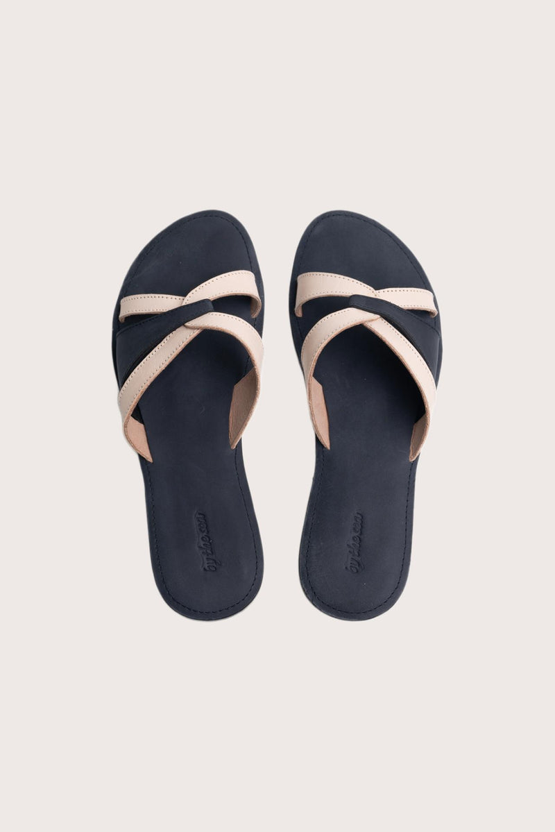 Mina sandal in navy shown in a global view highlighting its full silhouette and refined resort design