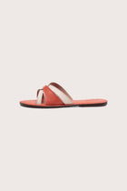 Side profile of Mina sandal in orange highlighting sleek and modern resort footwear silhouette