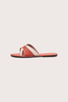 Side profile of Mina sandal in orange highlighting sleek and modern resort footwear silhouette