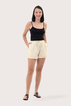 Woman wearing the Miwa Linen Short Creme designed for effortless resortwear and tropical living by By The Sea Bali.