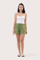 Woman wearing the Miwa Linen Short Green designed for effortless resortwear and tropical living by By The Sea Bali.