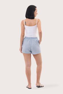 Back view of the Miwa Linen Short Light Blue highlighting the garment shape and drape