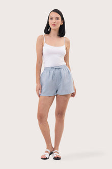 Woman wearing the Miwa Linen Short Light Blue designed for effortless resortwear and tropical living by By The Sea Bali.