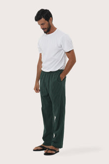 Side profile of the Moe Striped Pajama Set in Green by By The Sea Bali, crafted in soft cotton-hemp blend