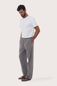 Side profile of the Moe Striped Pajama Set in Grey by By The Sea Bali, tailored in soft cotton-hemp blend