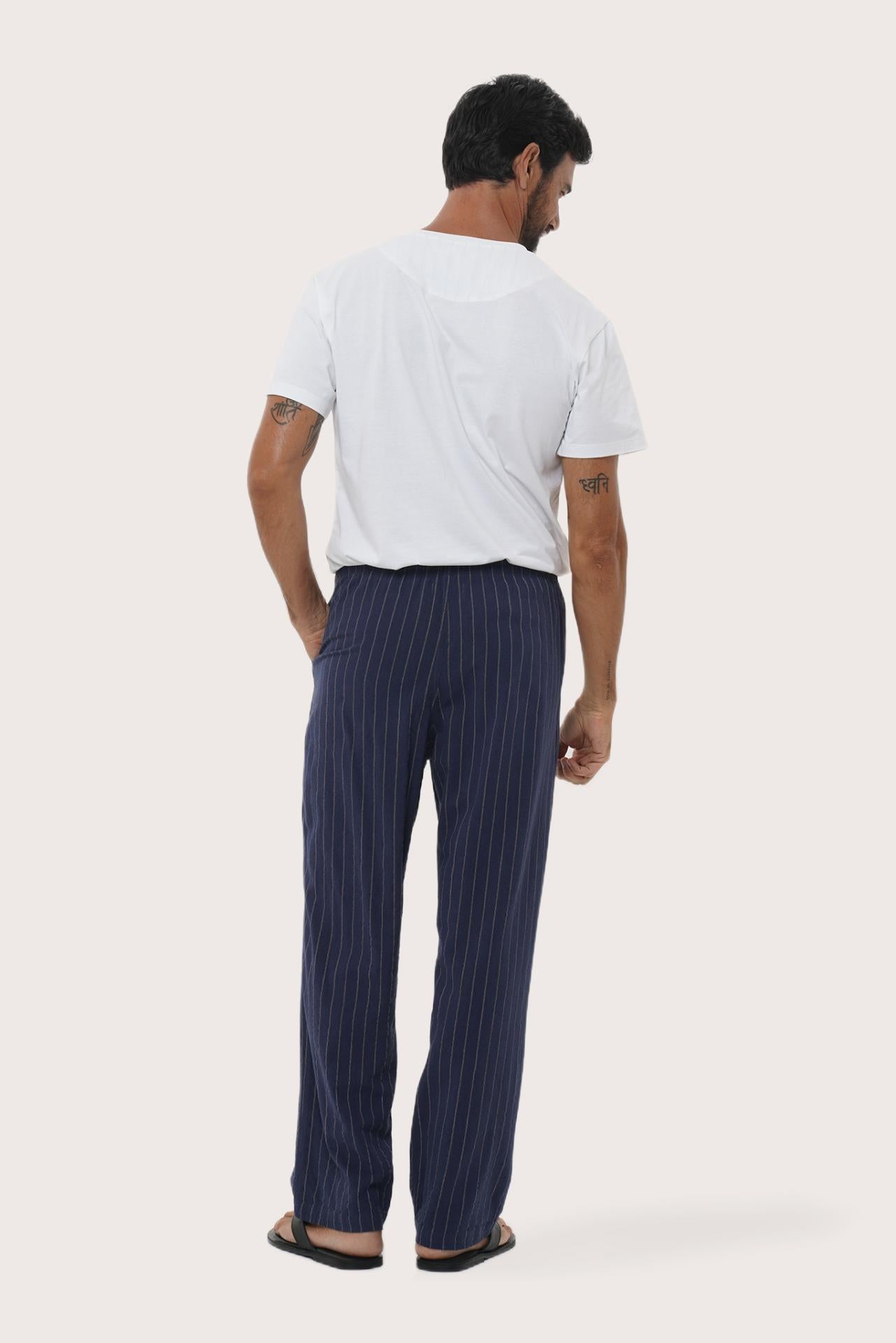 Back view of the Navy Moe Striped Pajama Set showcasing its relaxed lounge silhouette by By The Sea Bali