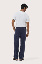 Back view of the Navy Moe Striped Pajama Set showcasing its relaxed lounge silhouette by By The Sea Bali
