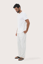 Side view of the Moe Striped Pajama Set in Off White by By The Sea Bali in soft cotton-hemp blend