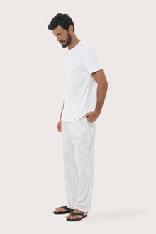 Side view of the Moe Striped Pajama Set in Off White by By The Sea Bali in soft cotton-hemp blend