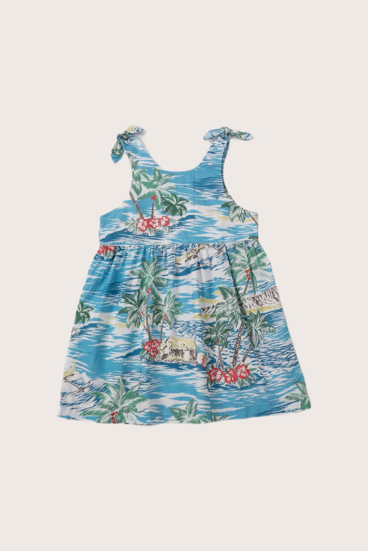 Back view of the light blue Tropical Day tie dress with a relaxed and feminine silhouette