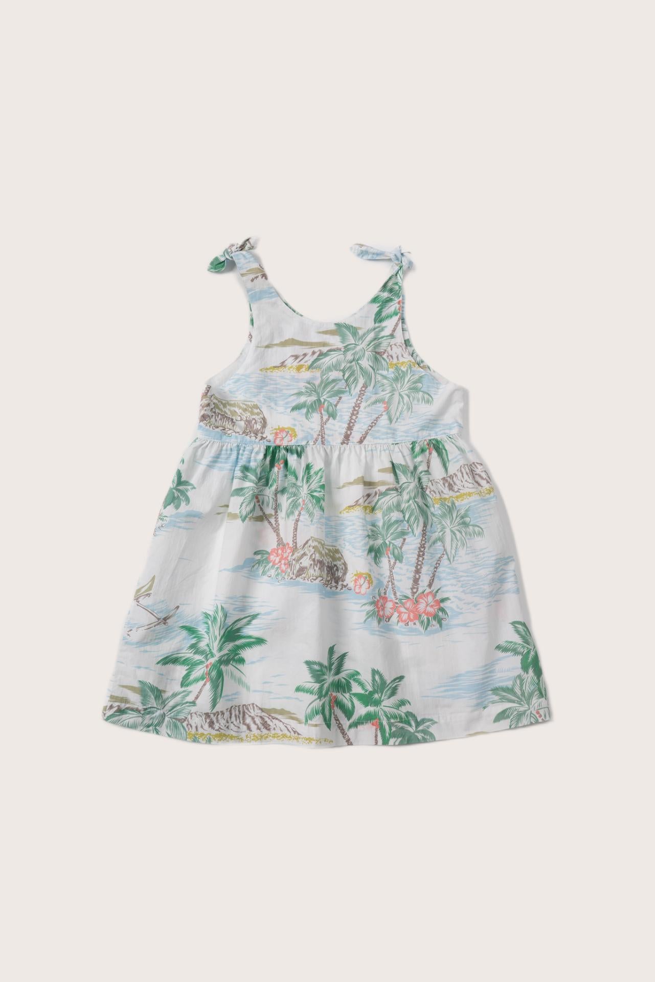 Back view of the white Tropical Day tie dress with a relaxed and feminine silhouette